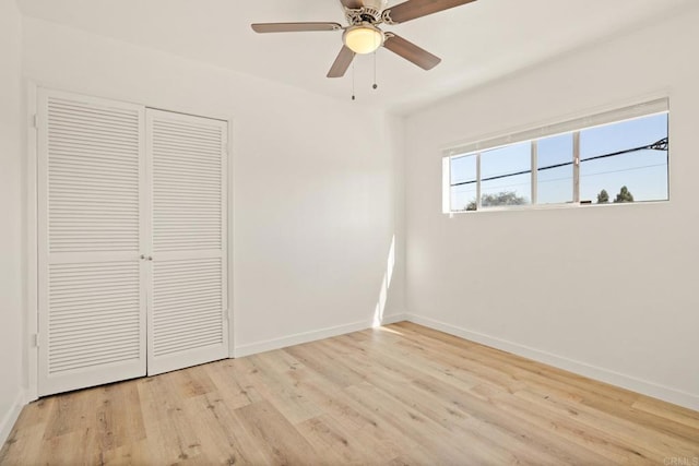 unfurnished bedroom with a closet, ceiling fan, and light hardwood / wood-style flooring