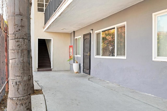 view of exterior entry featuring a patio