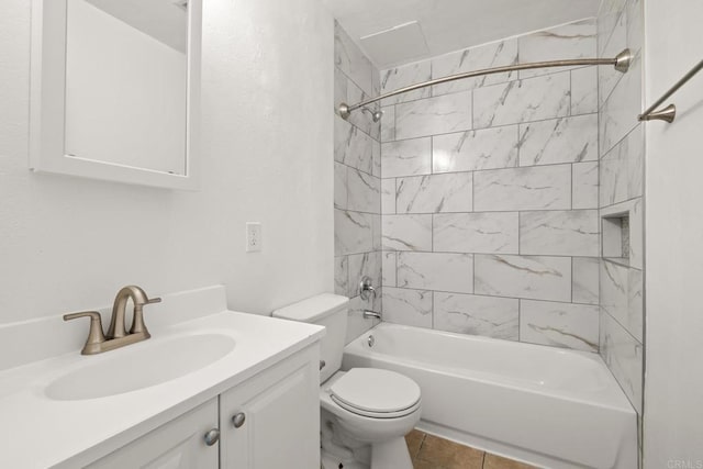 full bathroom with tile patterned flooring, vanity, toilet, and tiled shower / bath