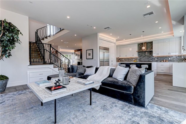 living room with light hardwood / wood-style floors