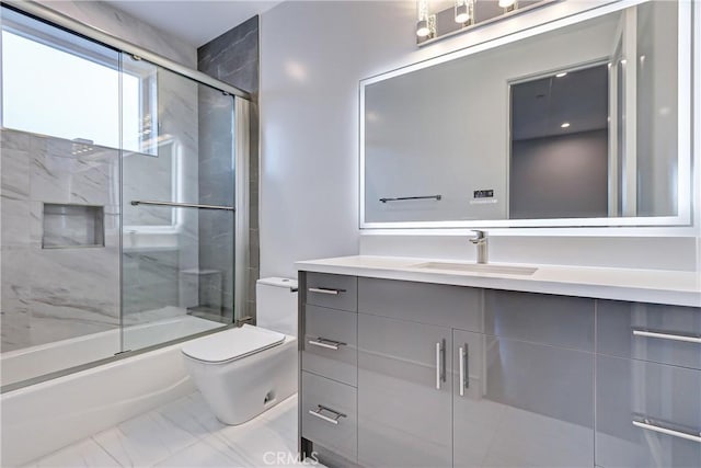 full bathroom featuring shower / bath combination with glass door, vanity, toilet, and a fireplace