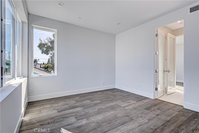 unfurnished room featuring wood-type flooring