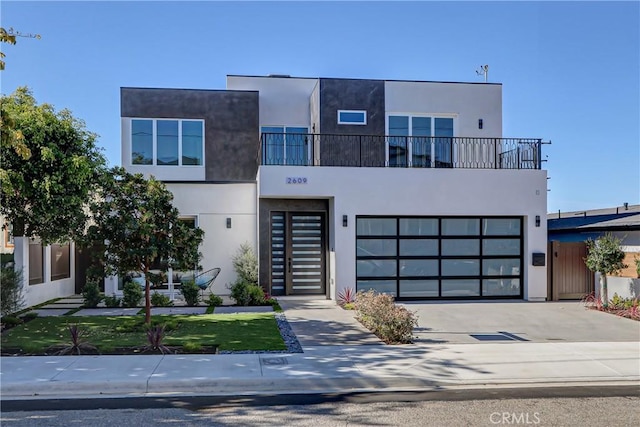 contemporary house with a balcony and a garage