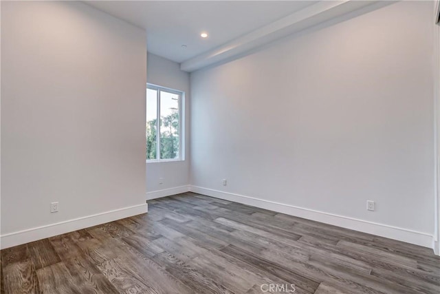 empty room featuring hardwood / wood-style floors