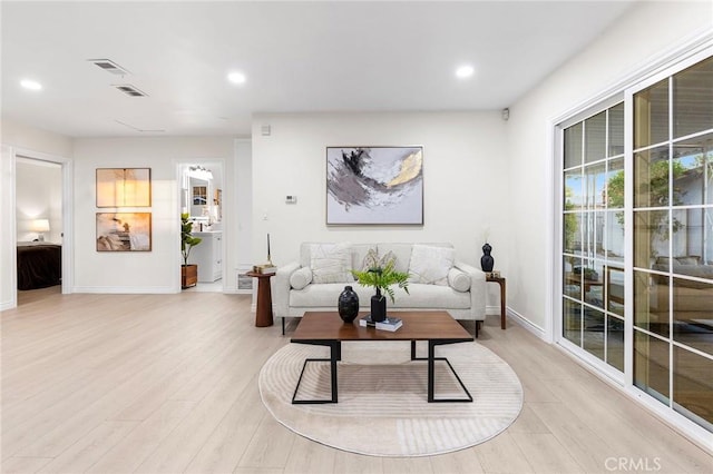 living room with light hardwood / wood-style floors