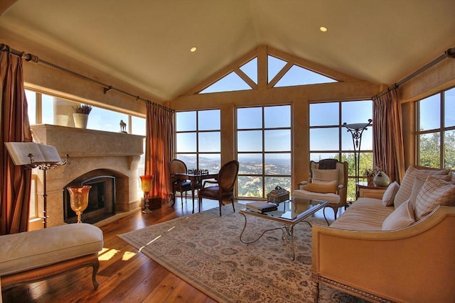 living room featuring hardwood / wood-style floors and lofted ceiling