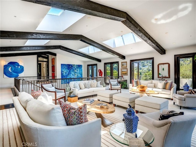 living room with vaulted ceiling with skylight and hardwood / wood-style flooring