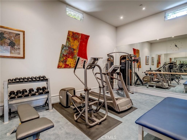 workout area featuring carpet flooring