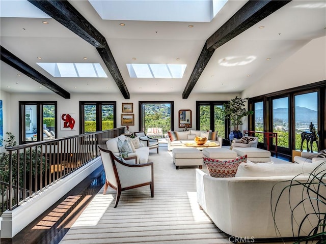 living room with high vaulted ceiling, french doors, a skylight, light wood-type flooring, and beamed ceiling