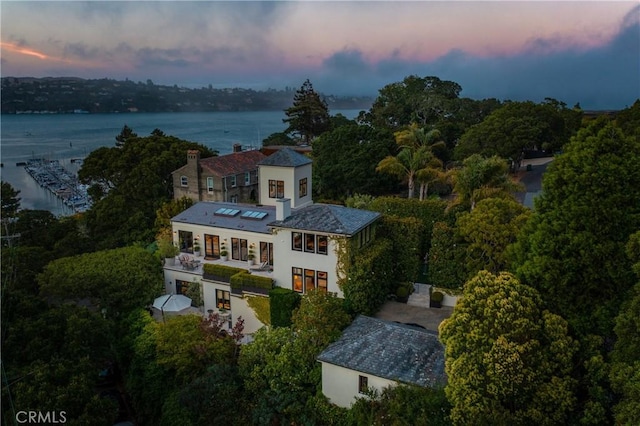 aerial view at dusk with a water view