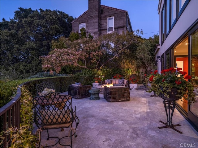 patio terrace at dusk with an outdoor fire pit