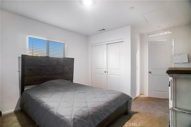 carpeted bedroom with a closet