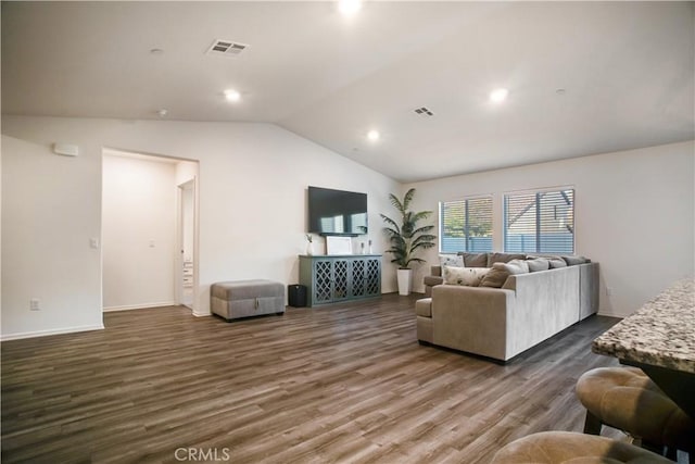 living room with dark hardwood / wood-style flooring and lofted ceiling