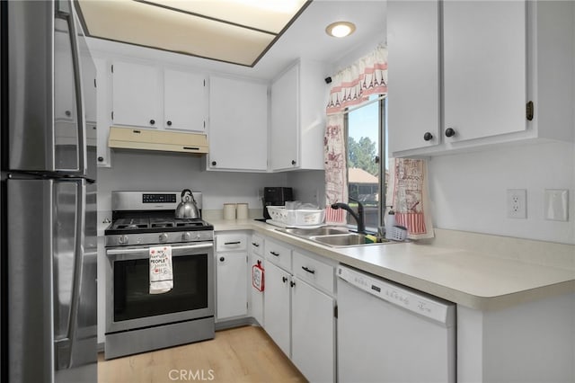 kitchen featuring white cabinets, light hardwood / wood-style floors, sink, and appliances with stainless steel finishes