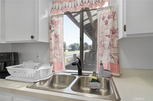 kitchen with white cabinets and sink