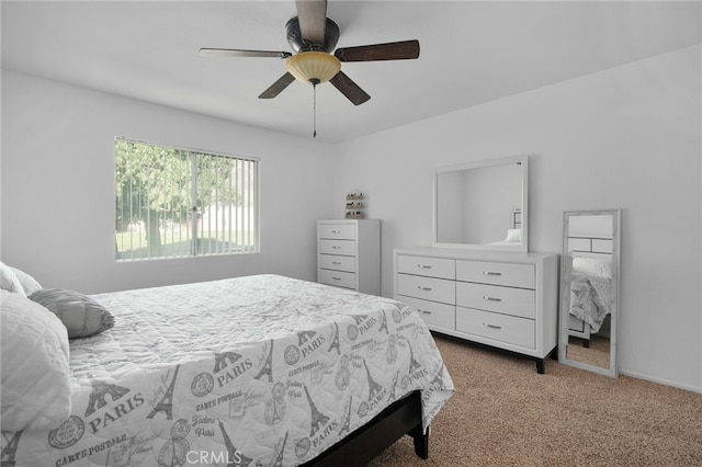 bedroom featuring ceiling fan and light carpet