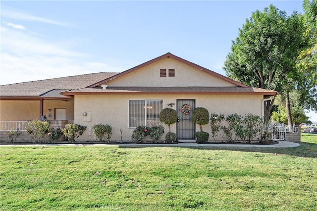 ranch-style house with a front yard