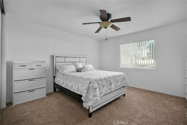 bedroom with ceiling fan and carpet floors