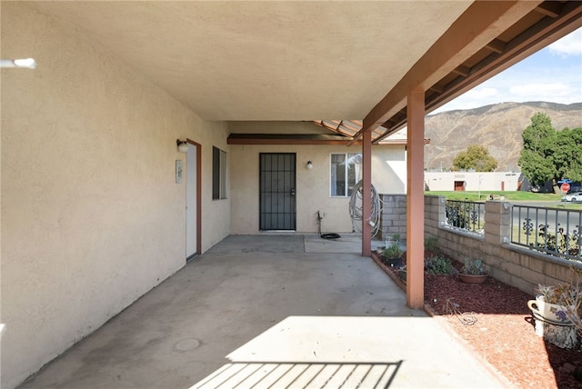 view of patio / terrace with a mountain view