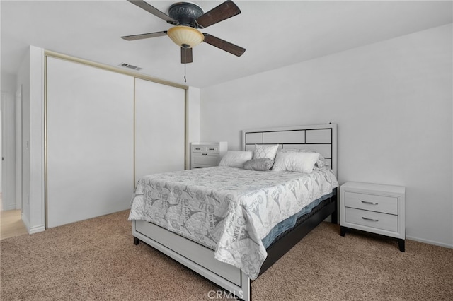 carpeted bedroom featuring ceiling fan