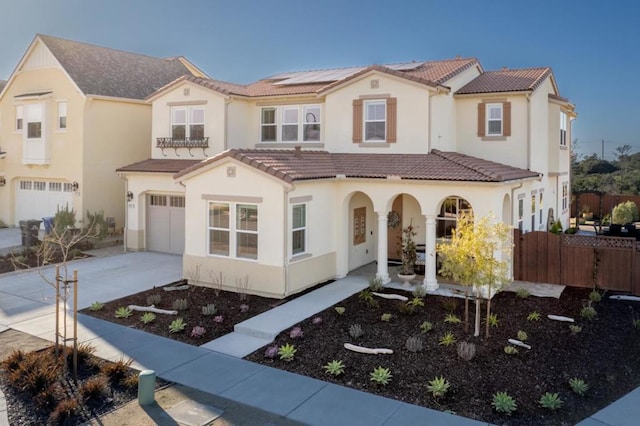 mediterranean / spanish house featuring a garage