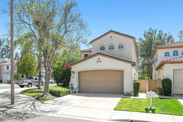 mediterranean / spanish-style house featuring a garage