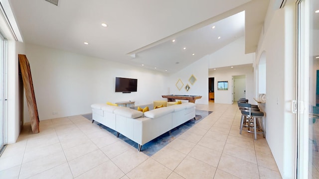 living room with high vaulted ceiling, light tile patterned floors, and billiards