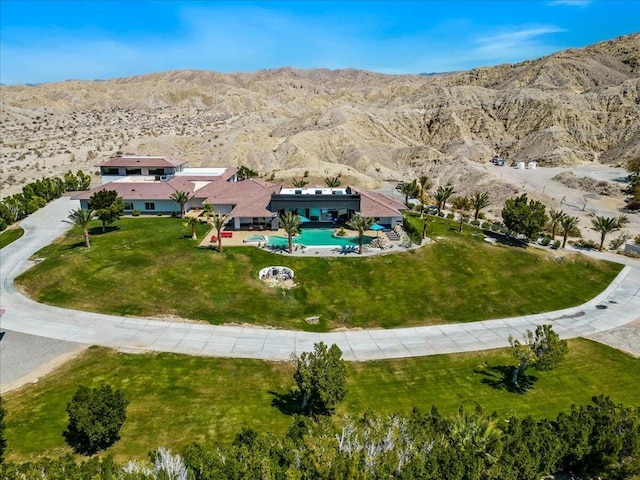 birds eye view of property with a mountain view