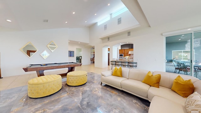 living room featuring high vaulted ceiling and billiards