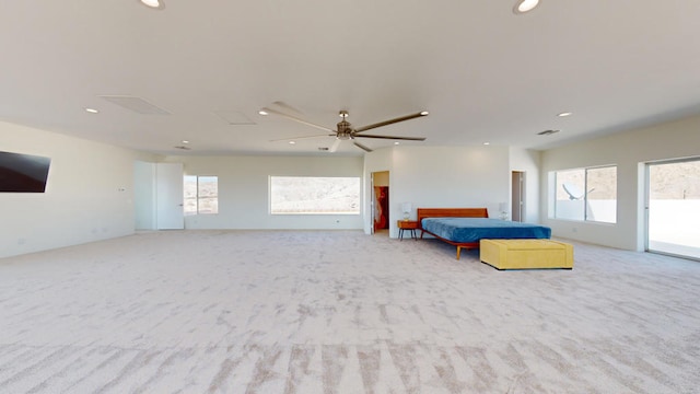 carpeted bedroom featuring ceiling fan and access to exterior