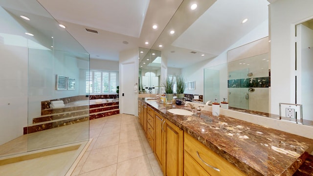 bathroom featuring tile patterned flooring, vanity, and independent shower and bath