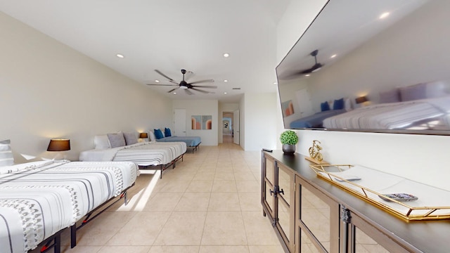 bedroom with ceiling fan and light tile patterned floors