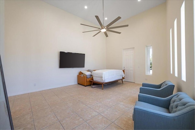 tiled bedroom featuring high vaulted ceiling and ceiling fan