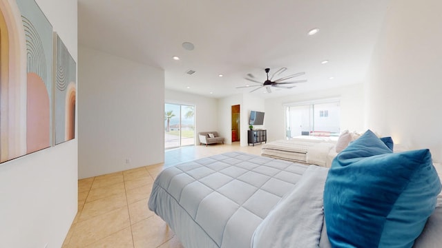 bedroom with ceiling fan and light tile patterned floors