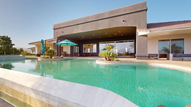 view of pool featuring a patio area