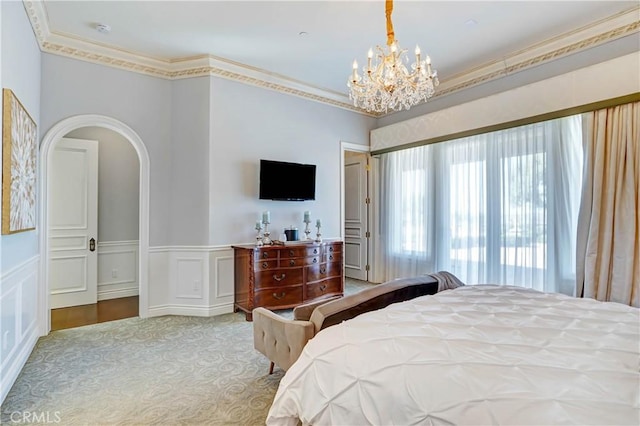 bedroom with an inviting chandelier and ornamental molding