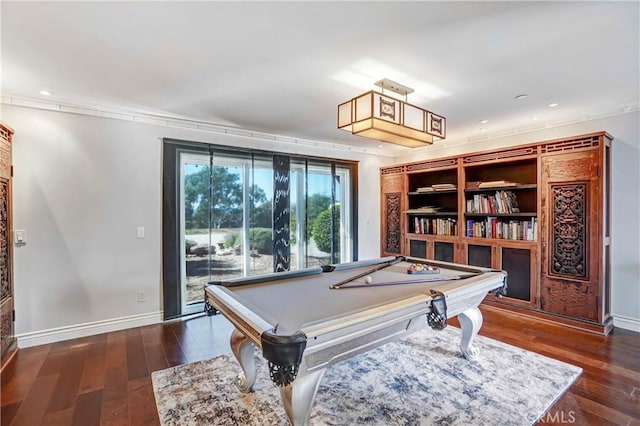 game room featuring crown molding, dark wood-type flooring, and pool table