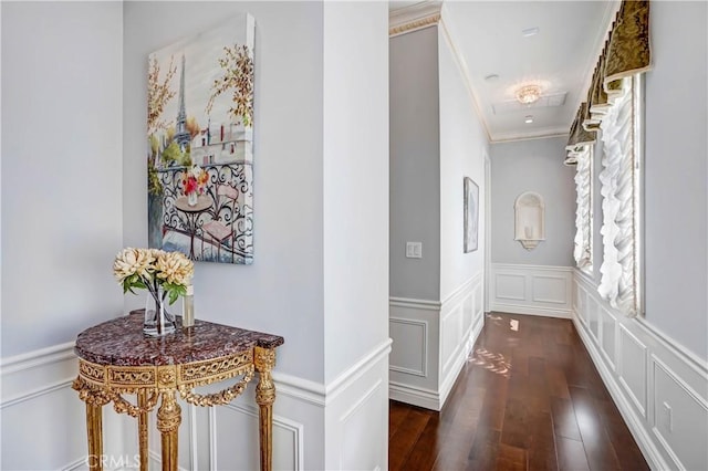 hall featuring dark hardwood / wood-style floors and crown molding