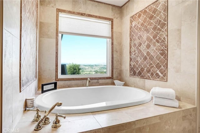 bathroom with tiled bath and tile walls