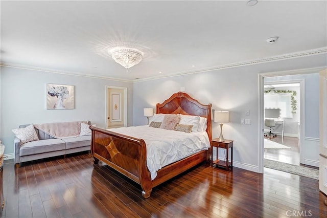 bedroom featuring ornamental molding, an inviting chandelier, and dark wood-type flooring