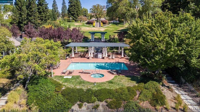 view of pool featuring a patio area, a pergola, and a yard