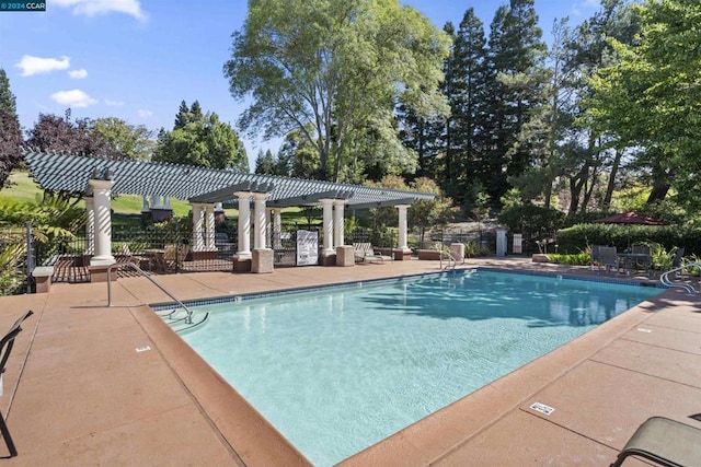 view of pool featuring a pergola and a patio