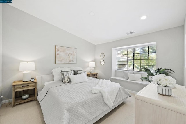 carpeted bedroom featuring lofted ceiling