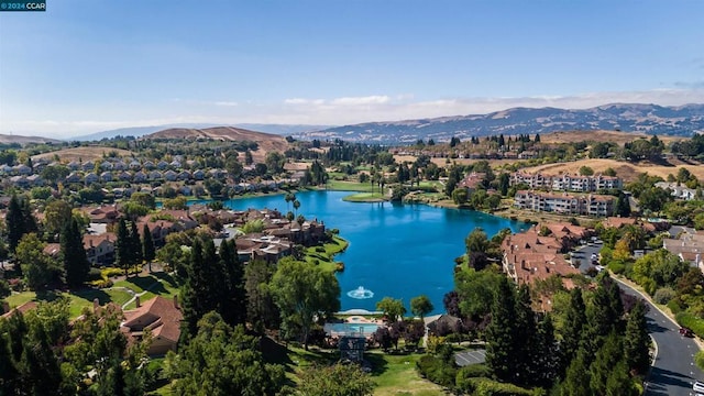 bird's eye view with a water and mountain view