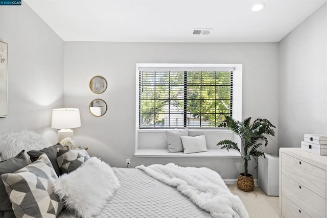 bedroom with light carpet