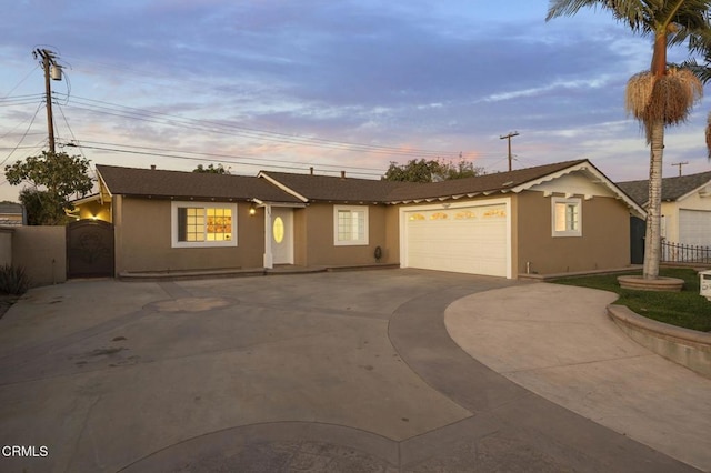 ranch-style house featuring a garage