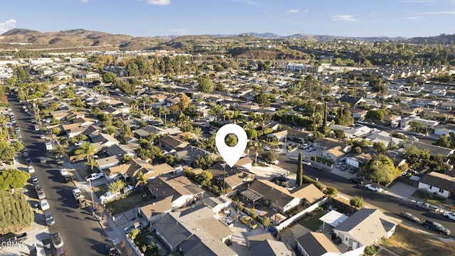 birds eye view of property with a mountain view