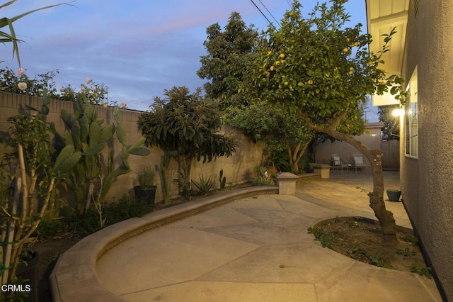 view of patio terrace at dusk