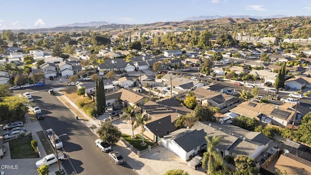 birds eye view of property with a mountain view