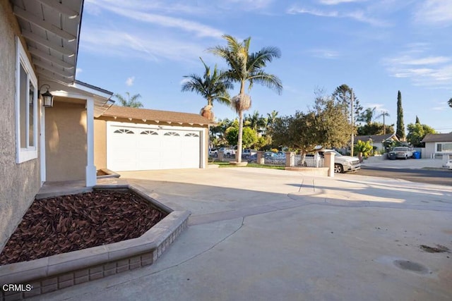 view of patio / terrace featuring a garage